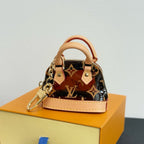 Louis Vuitton monogram mini handbag with tan leather top handle and chain