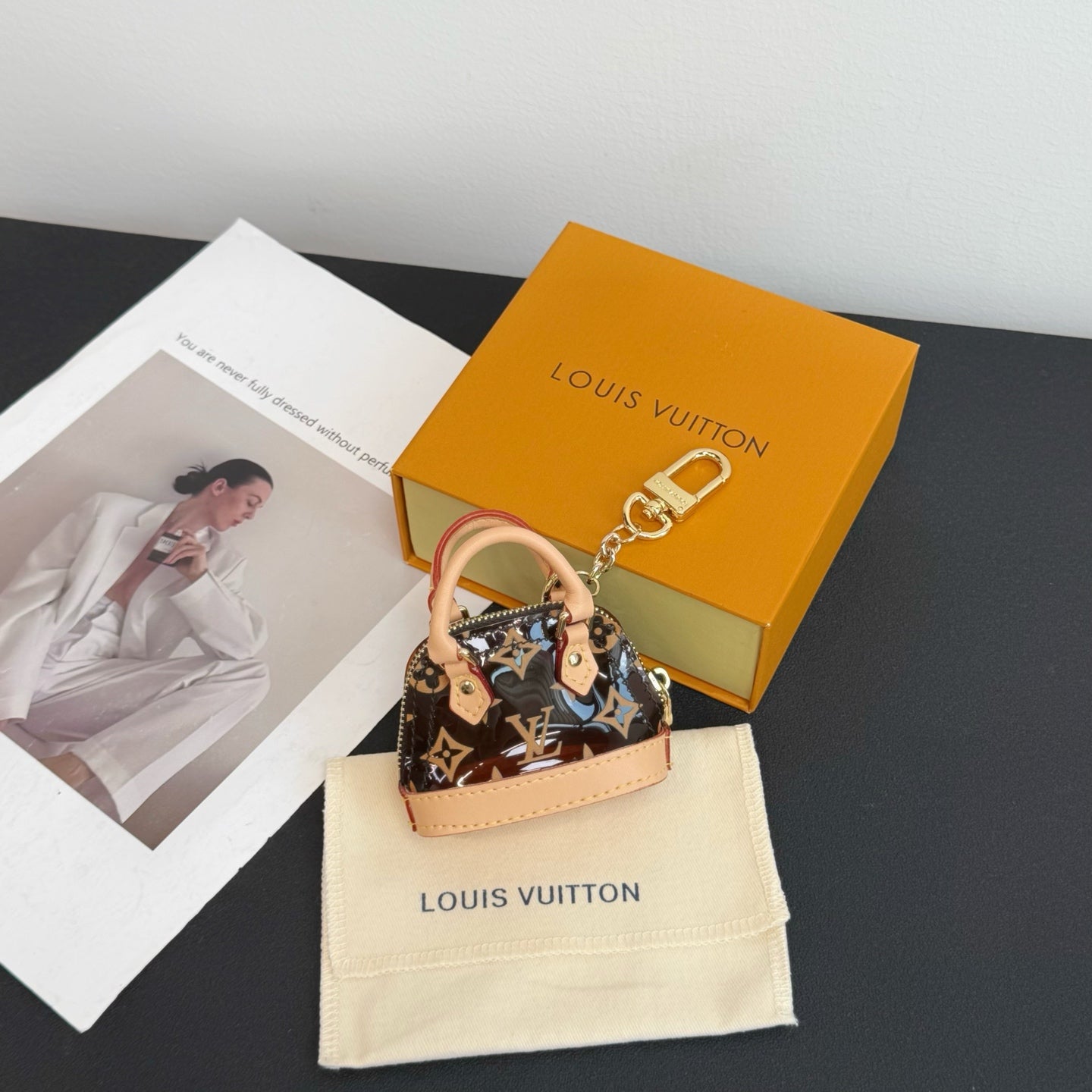 Louis Vuitton monogram mini handbag with pink trim and gold-tone chain strap