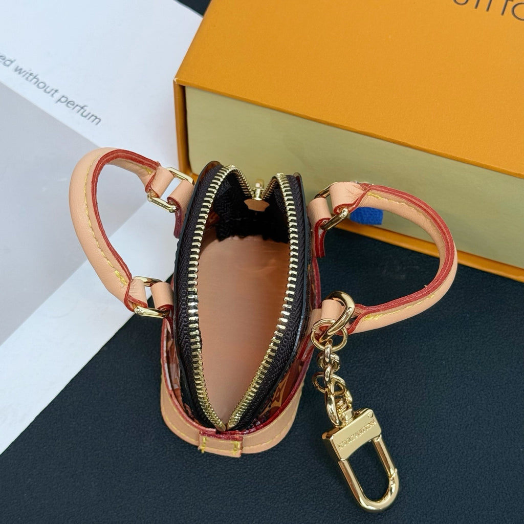Louis Vuitton monogram mini handbag charm with zipper pocket and gold keyring