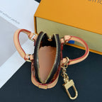 Louis Vuitton monogram mini handbag charm with zipper pocket and gold keyring