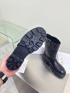 Dior ladies boot outsoles and heel profile, dark rubber lug tread