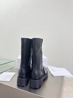 Dior ladies back view of mid-calf leather boots, dark pull-on with stacked heel