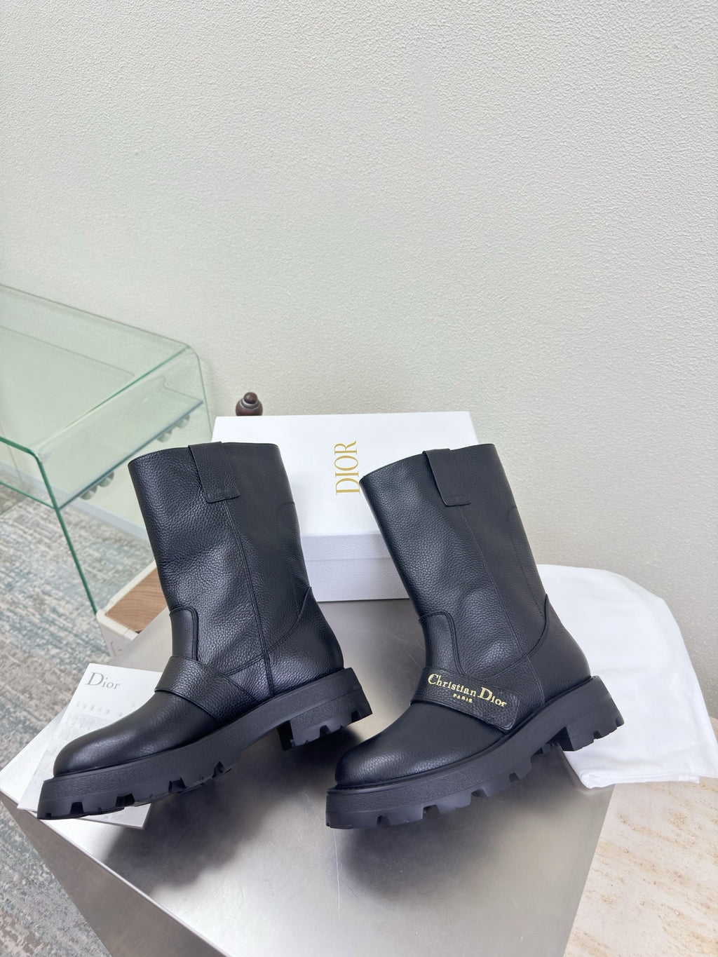 Dior ladies mid-calf leather boots, dark, front view with chunky lug sole