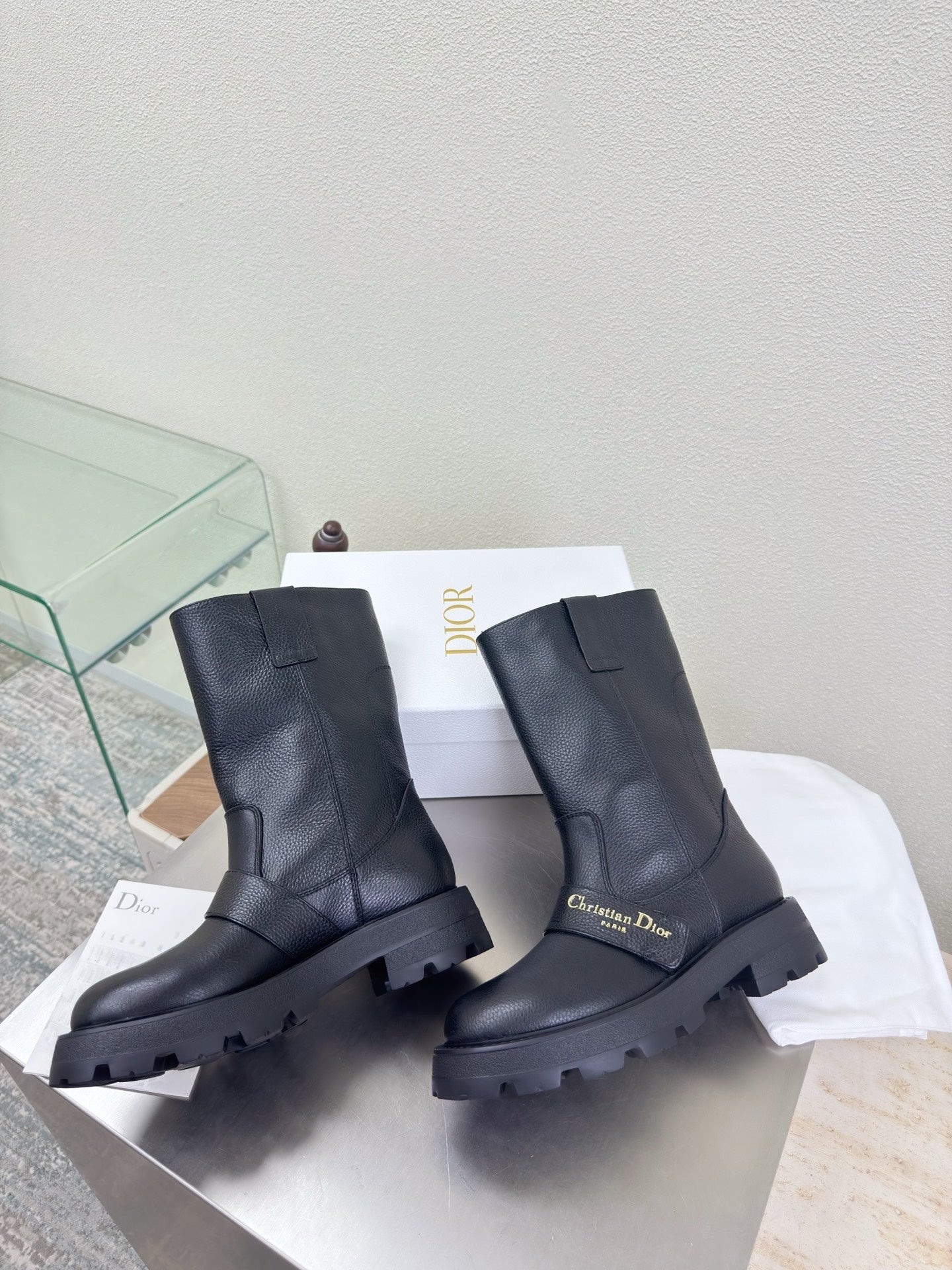 Dior ladies mid-calf leather boots, dark, front view with chunky lug sole