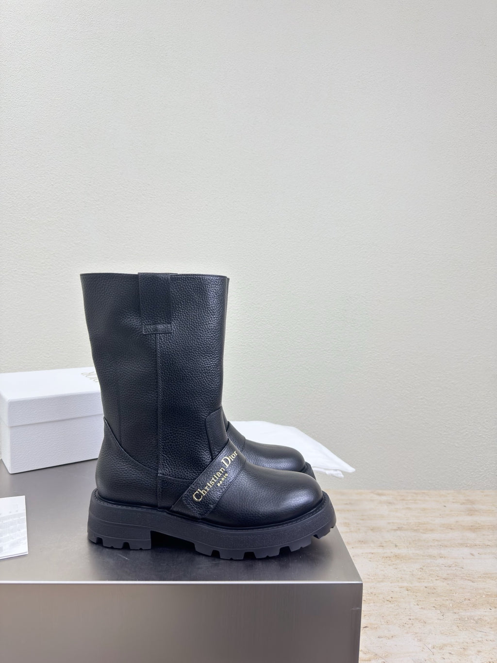 Dior ladies side view mid-calf boots in dark leather with rugged lug sole