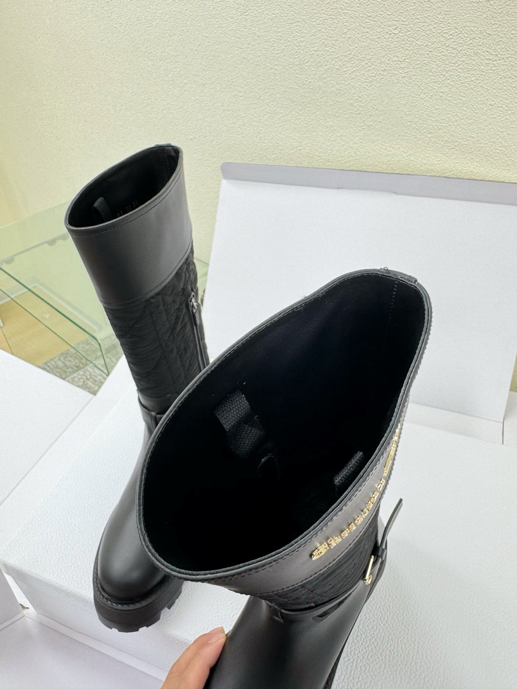 Women's Dior knee-high boots with open top showing black interior lining