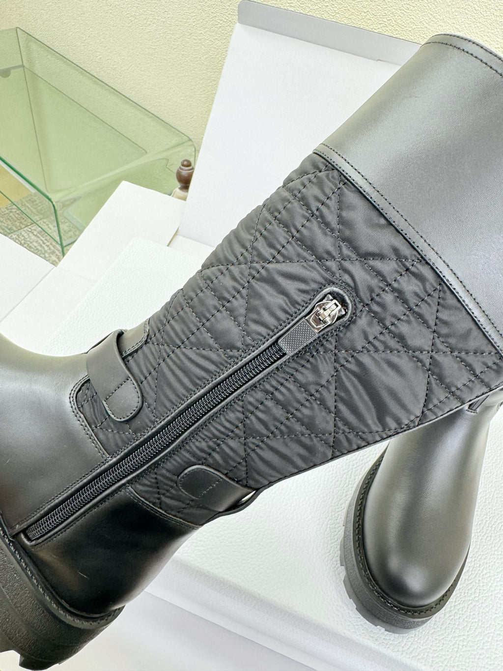 Women's Dior knee-high boot with diagonal zipper and metal pull tab detail