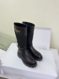 Women's Dior knee-high boots in dark black, quilted shaft and lug sole