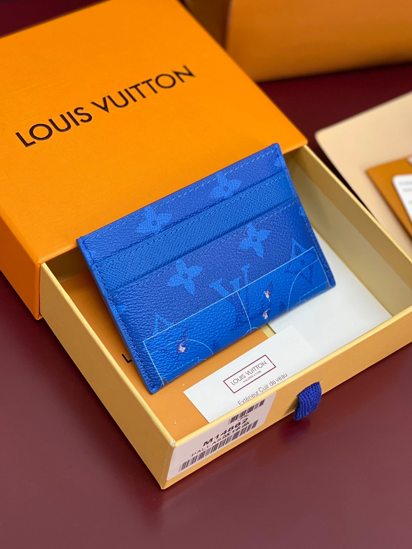 Louis Vuitton small bag, blue monogram leather, shown in box