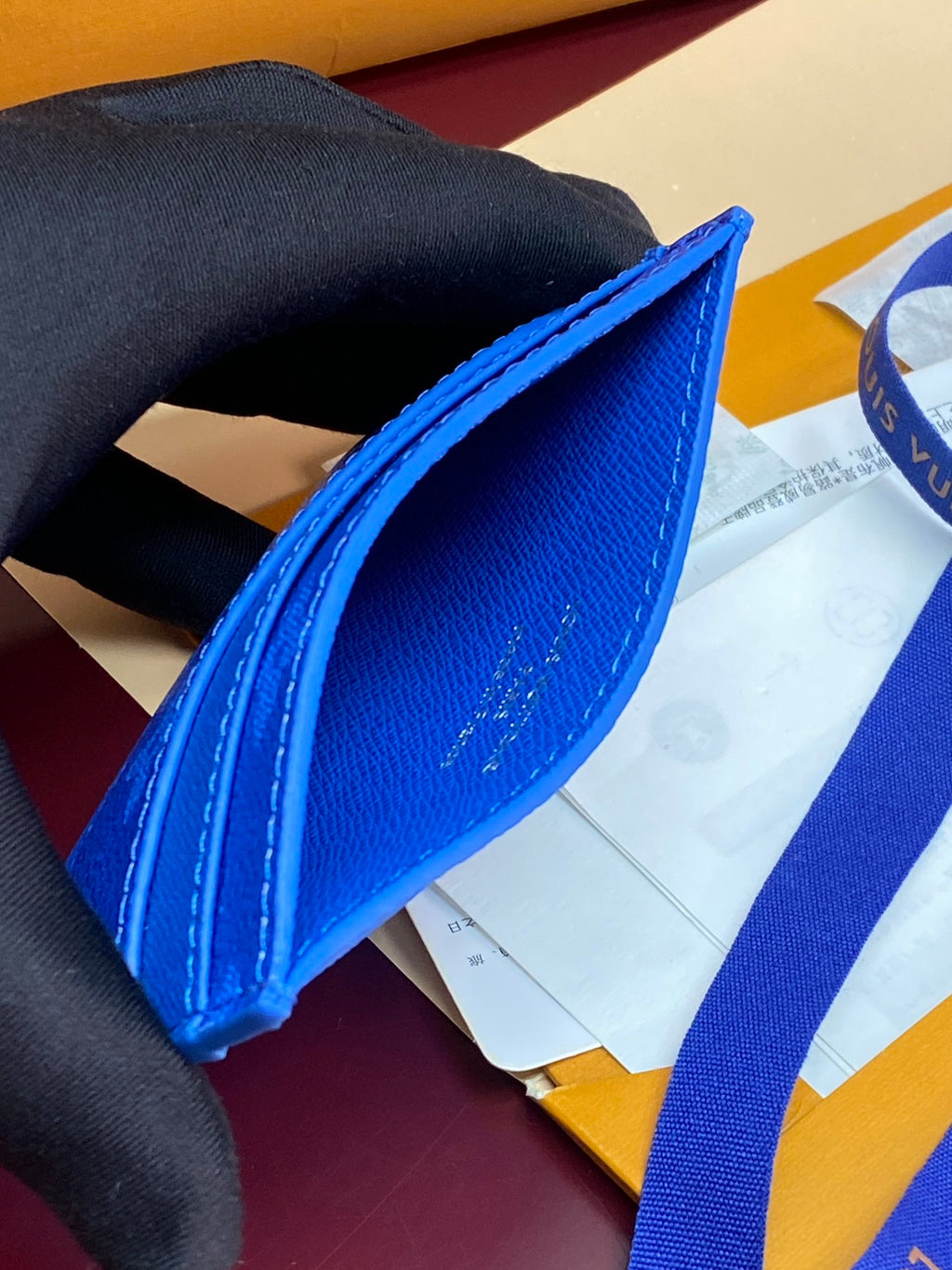 Louis Vuitton small bag, blue monogram leather edge with strap