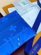 Louis Vuitton small bag close-up in blue monogram leather with blue strap