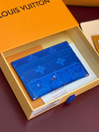 Louis Vuitton small bag in blue monogram leather, wallet style, in open box