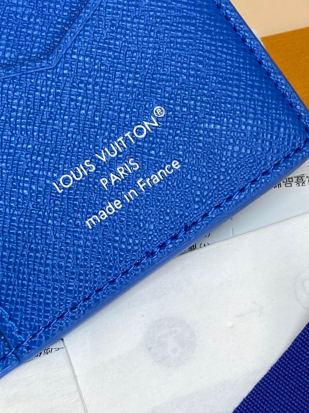 Blue small bag close-up showing Louis Vuitton “made in France” branding