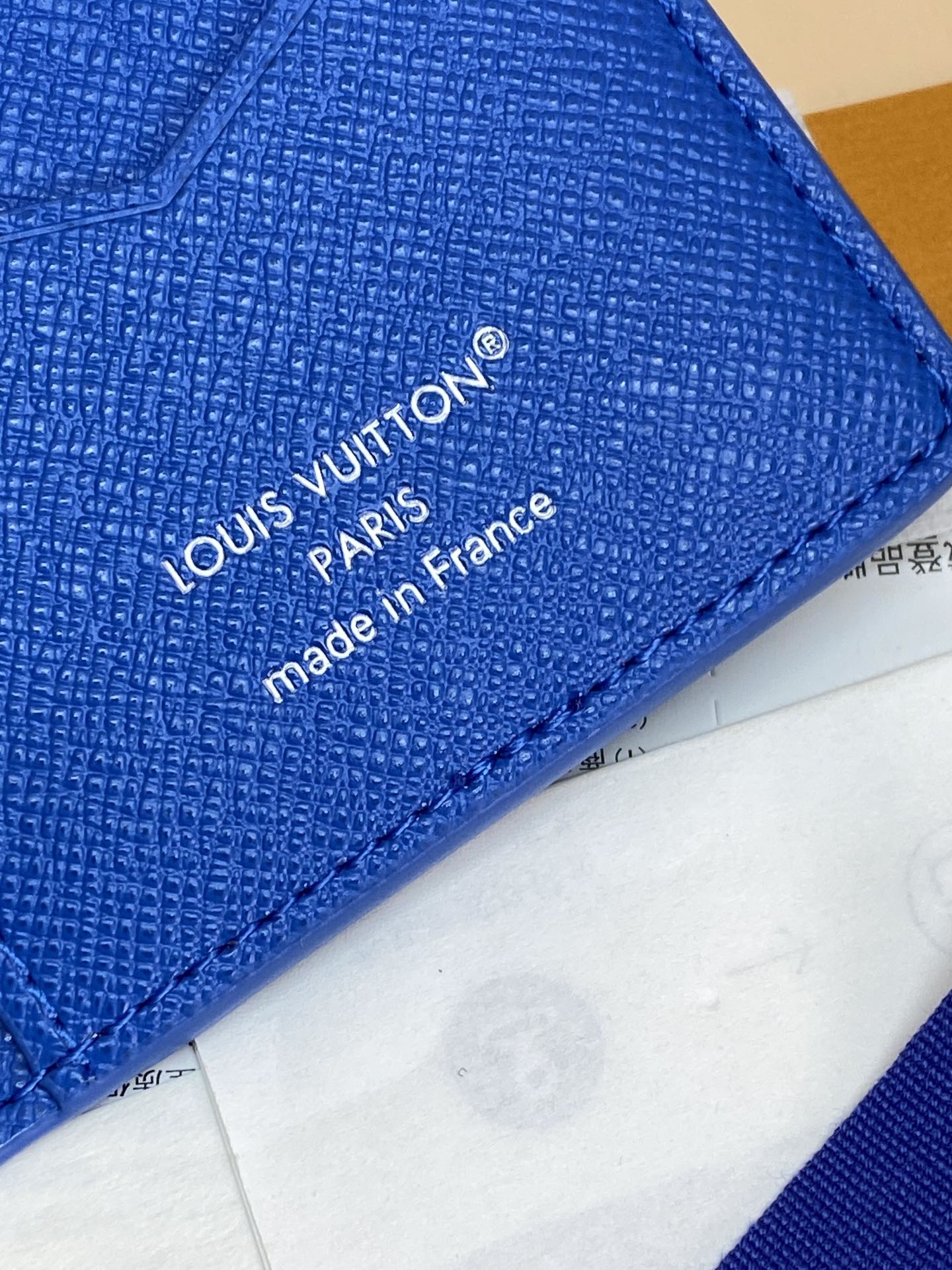 Blue small bag close-up showing Louis Vuitton “made in France” branding