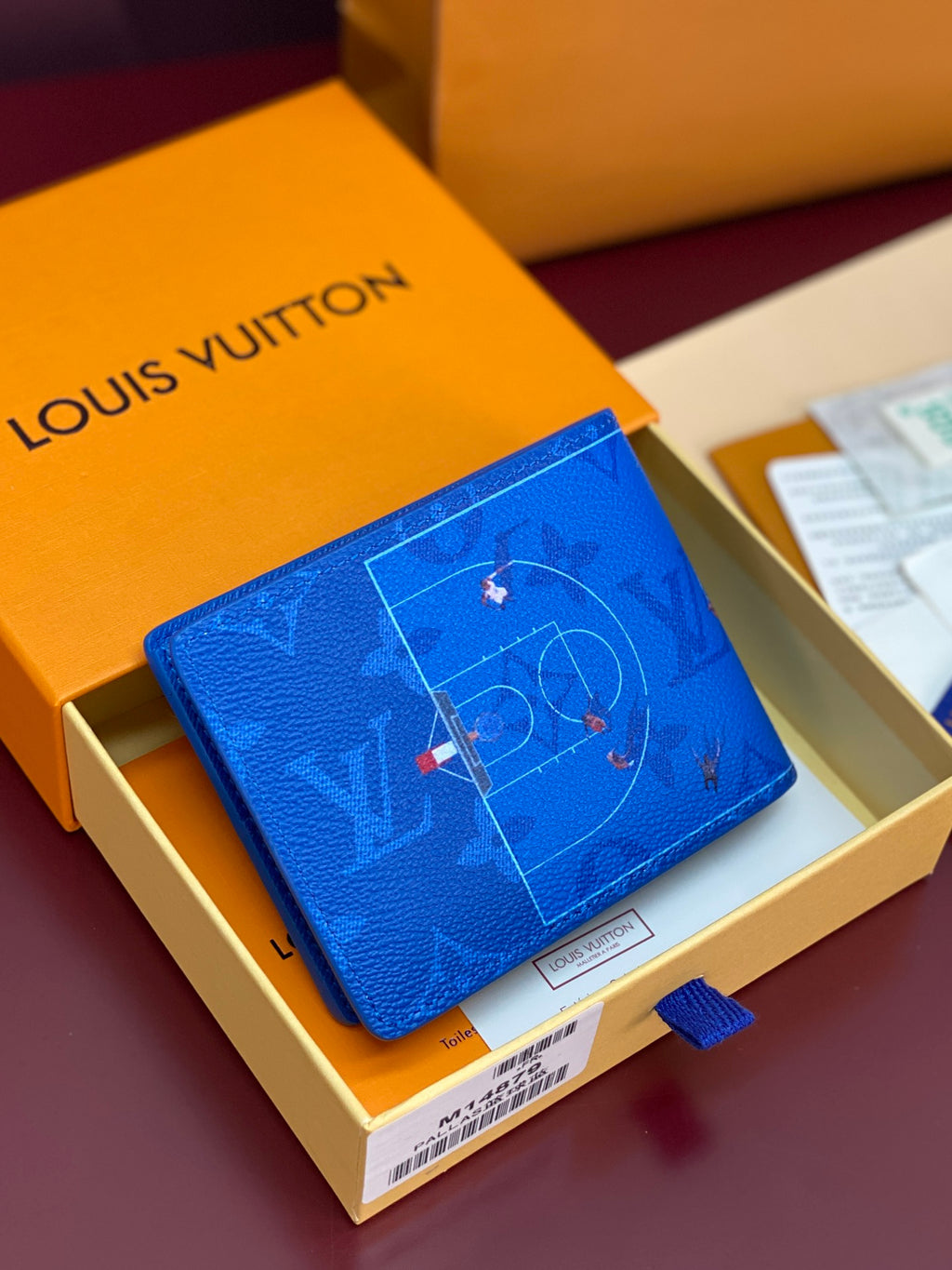 Blue Louis Vuitton small wallet with D-ring monogram and star motifs