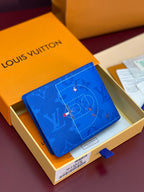 Blue Louis Vuitton small wallet with D-ring monogram and star motifs
