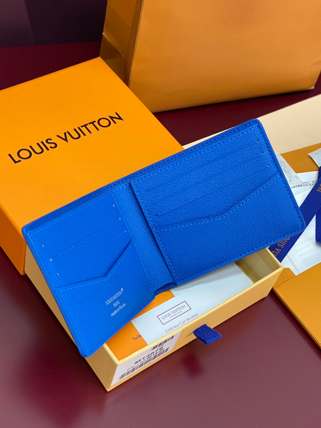 Blue Louis Vuitton small wallet with snap front and card slots