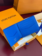Blue Louis Vuitton small wallet with snap front and card slots