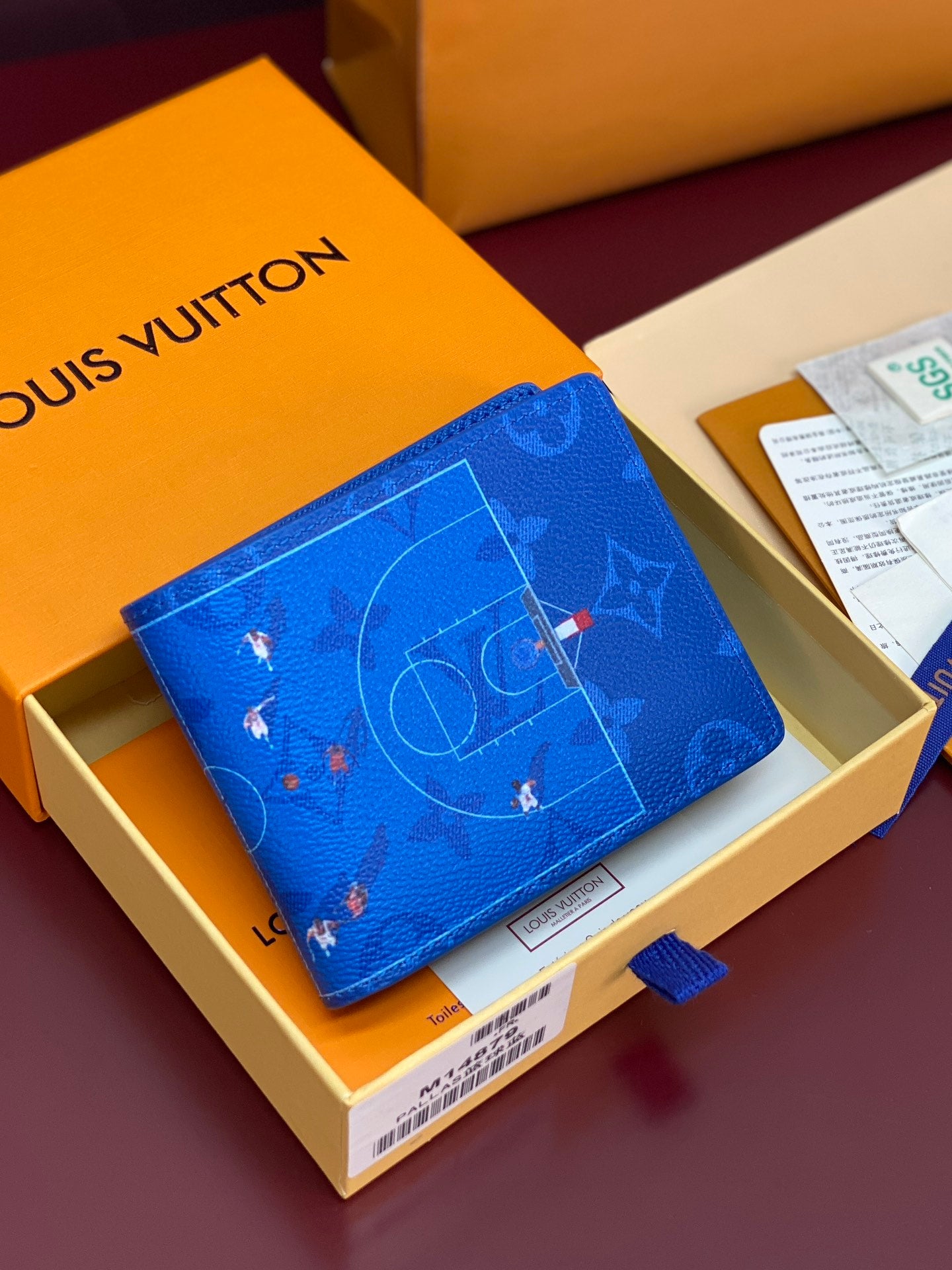 Blue Louis Vuitton small wallet with multicolor monogram pattern