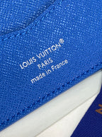 Blue Louis Vuitton leather wallet with 'made in France' stamp