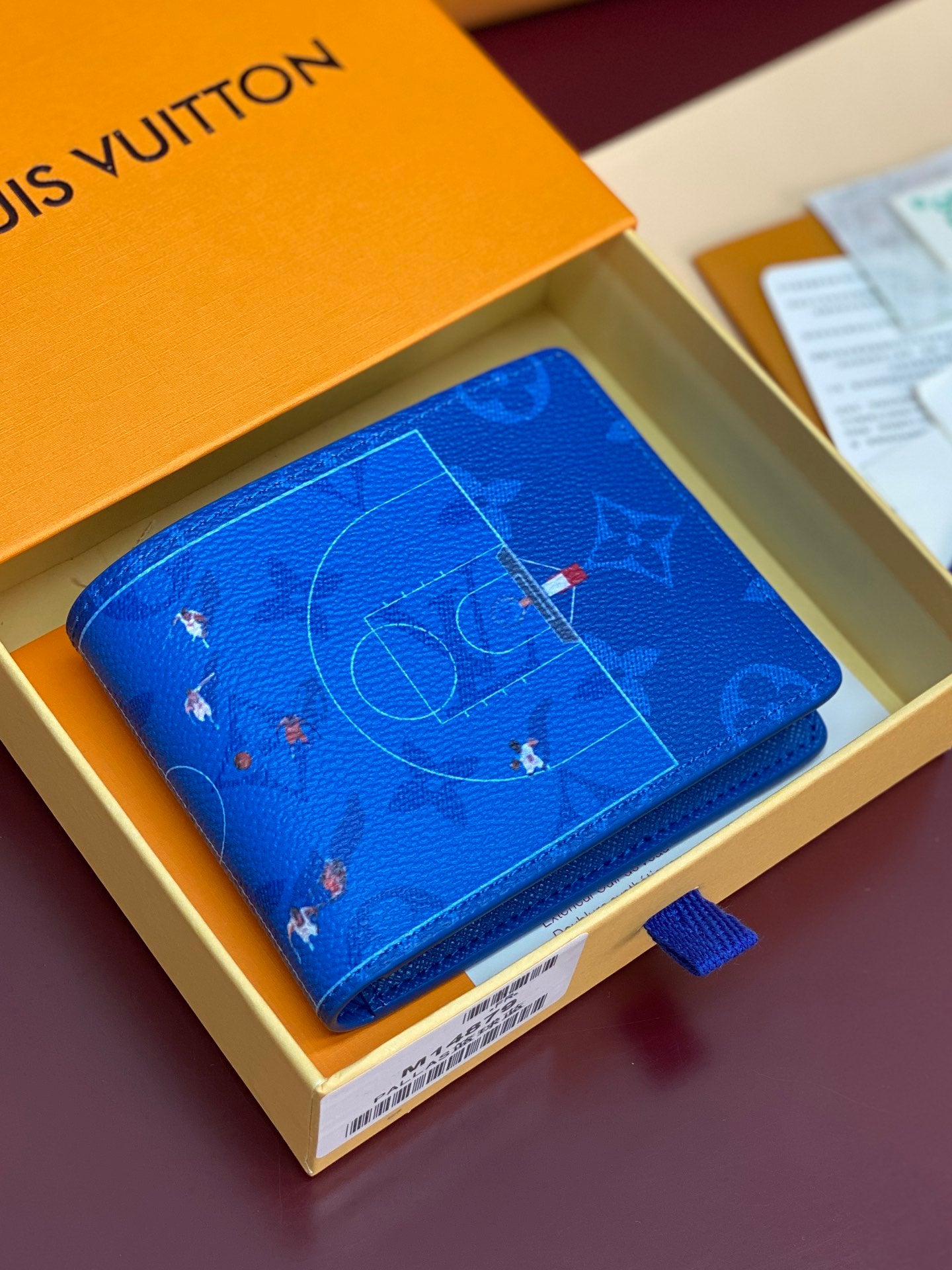 Blue Louis Vuitton small wallet with monogram map pattern and snap flap