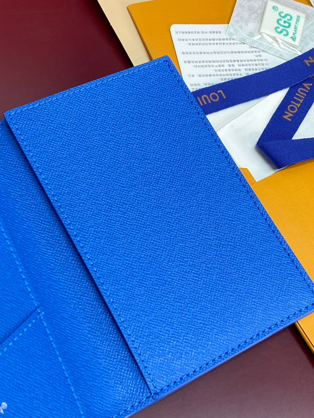 Blue small bag close-up of outer textured material and fold seam