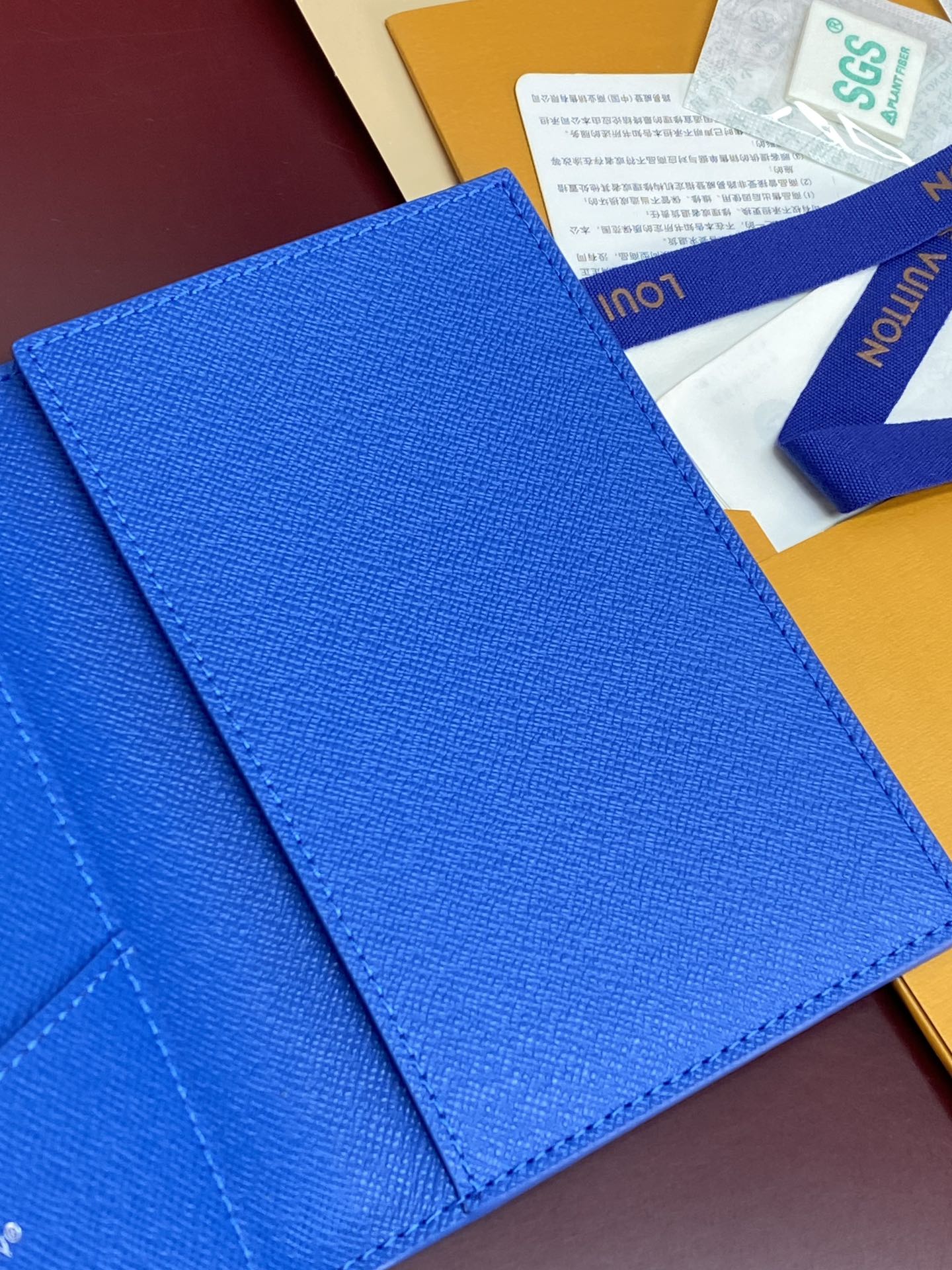 Blue small bag close-up of outer textured material and fold seam