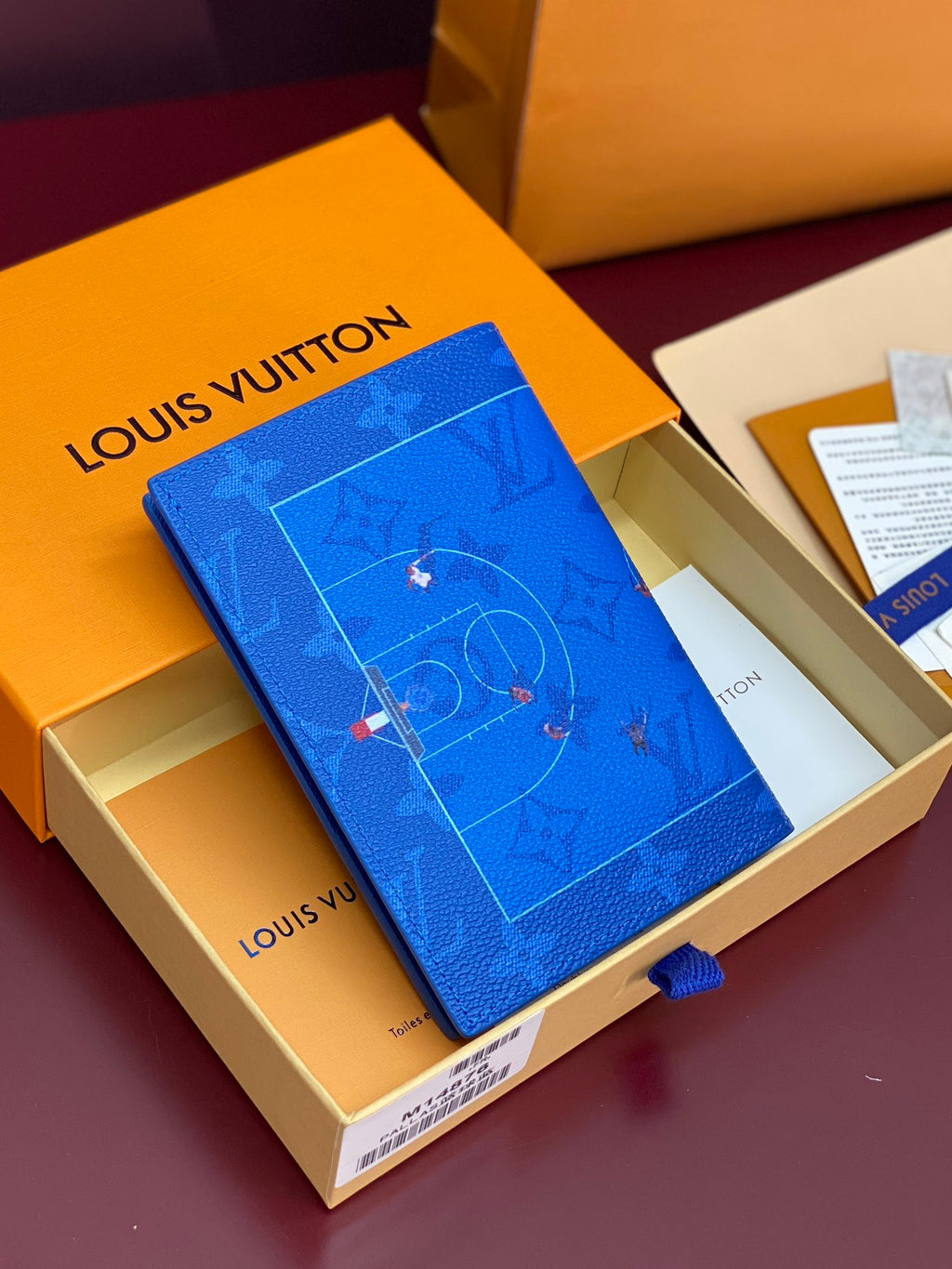 Blue small bag with Louis Vuitton monogram print, angled view
