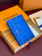 Blue small bag with Louis Vuitton monogram print, angled view