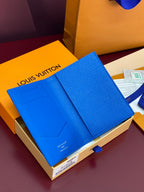 Blue small bag wallet with open flap and Louis Vuitton logo