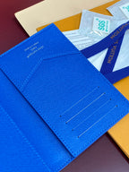 Blue small bag close-up showing card slot stitching and metal snap
