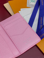 Pink Louis Vuitton small bag interior with stitched card-slot panel.