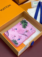Pink Louis Vuitton small bag with tropical floral and bird pattern, flap front.