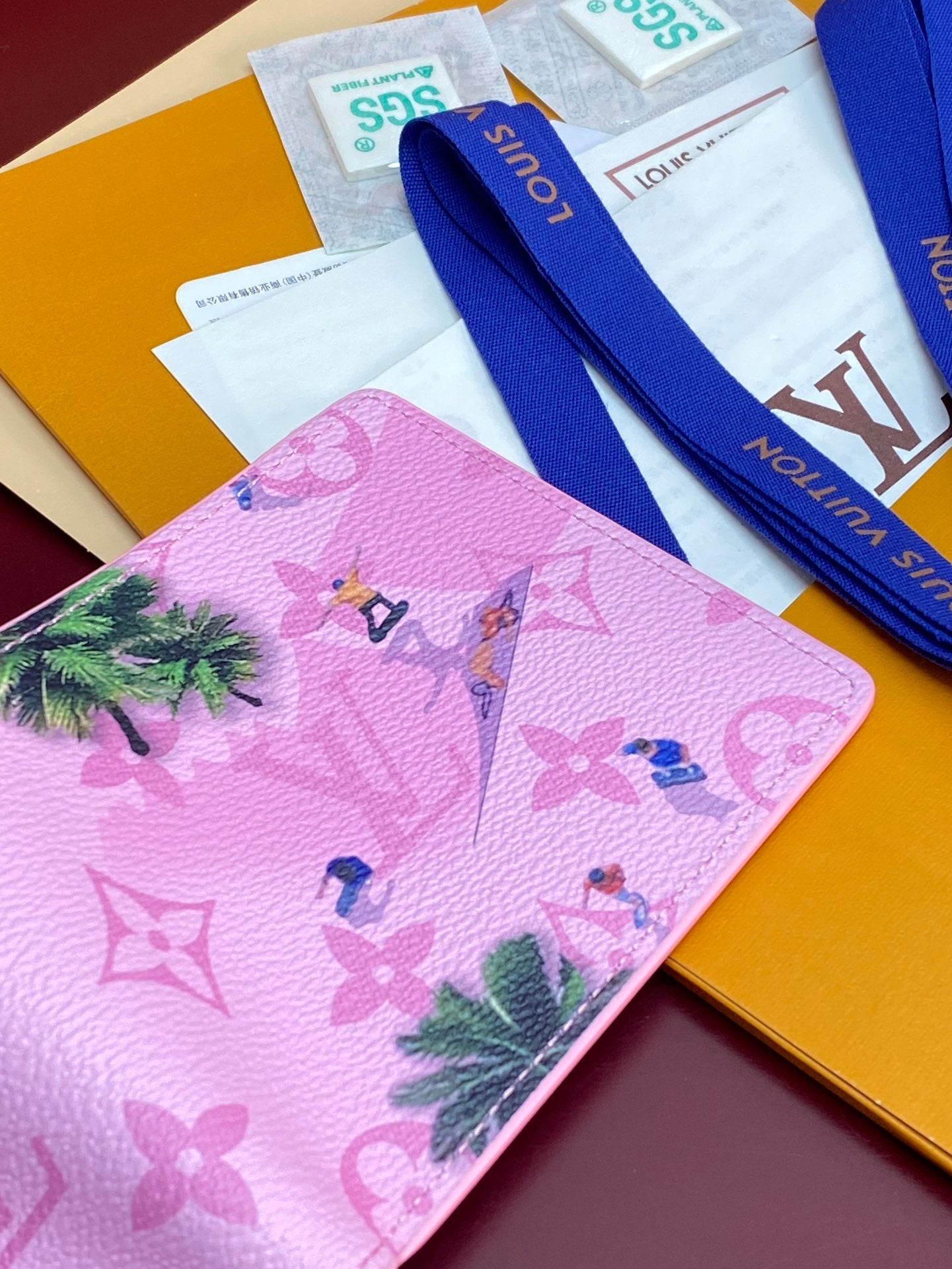 Pink small bag front with multicolor character print on Louis Vuitton monogram