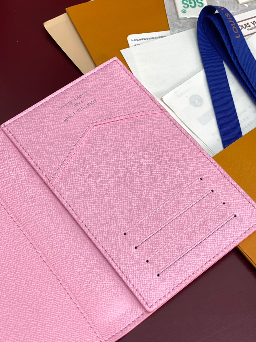 Pink small bag close-up of front card slots with stitching details