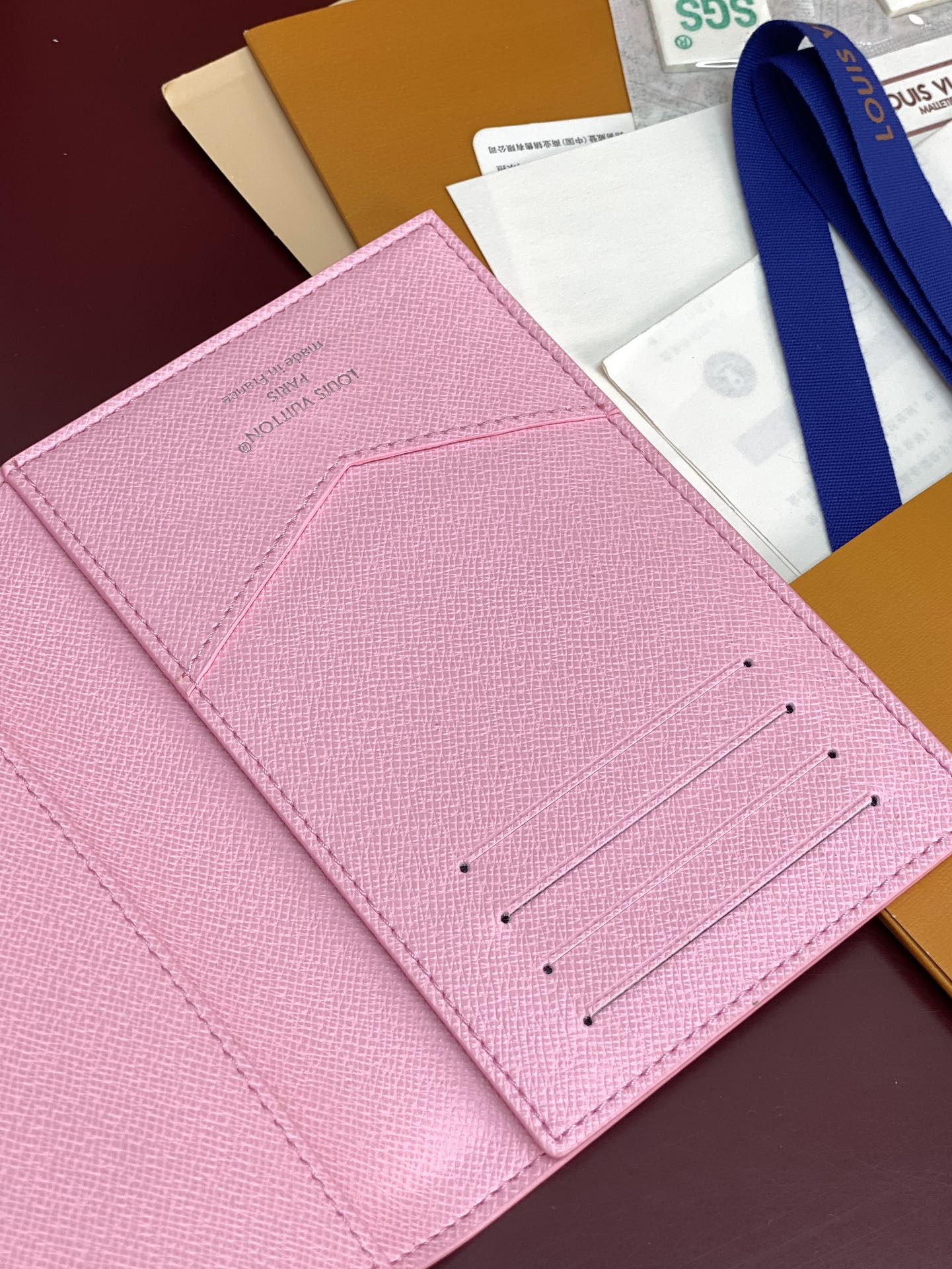 Pink small bag close-up of front card slots with stitching details