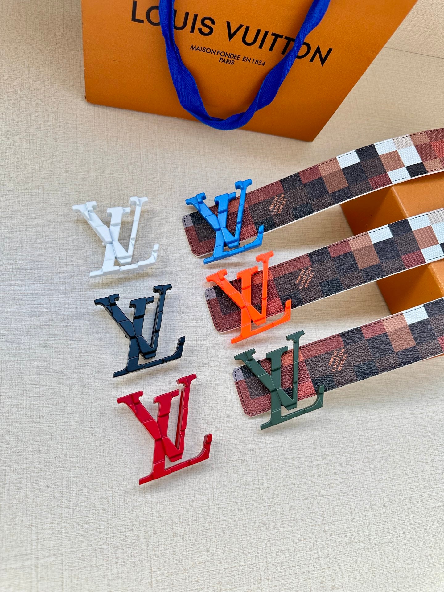 Louis Vuitton belt accessories: checkered strap with multicolor LV buckles