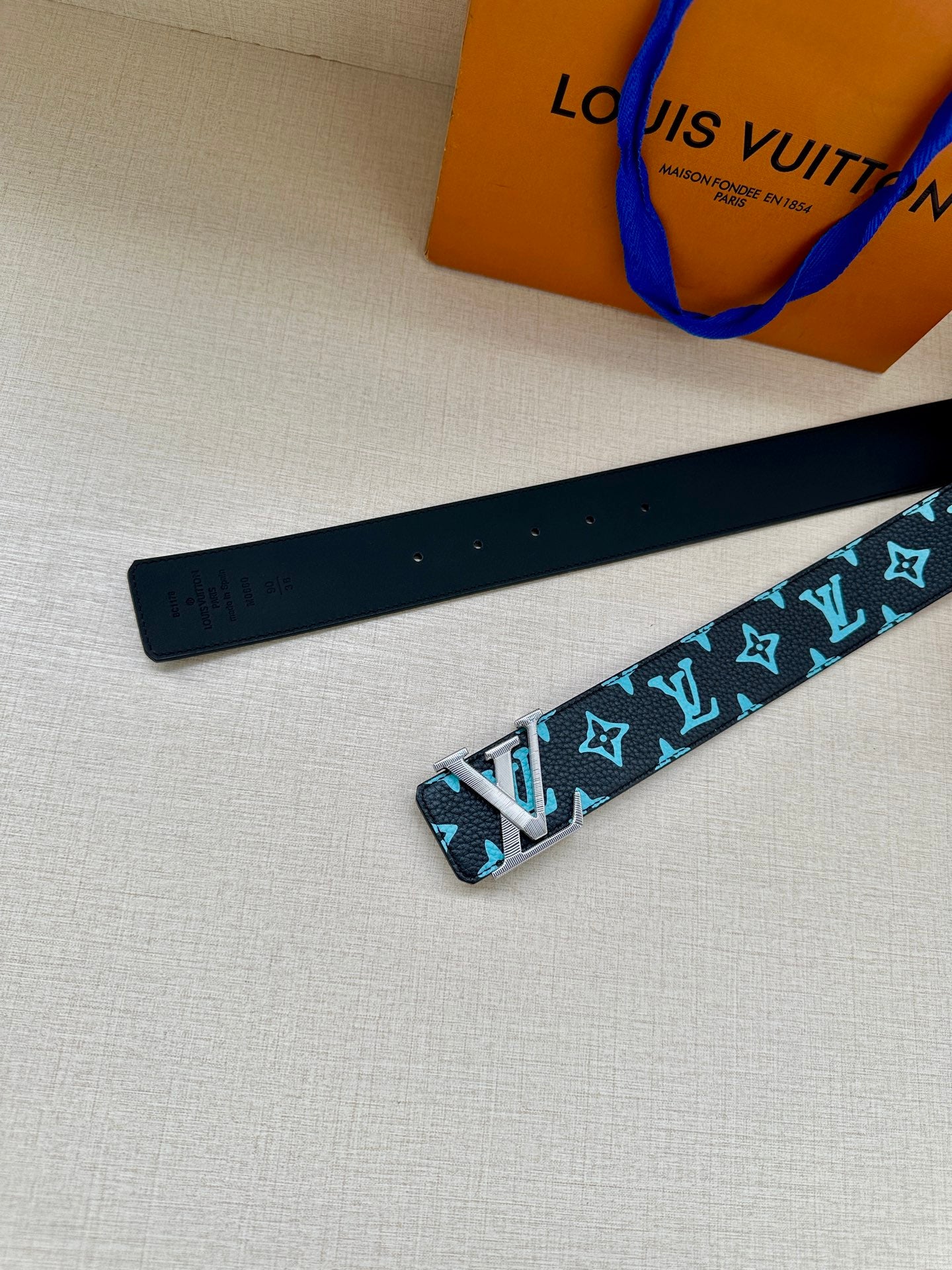 Louis Vuitton belt strap with turquoise monogram pattern and gold buckle hardware