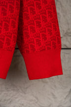 Red knit hoodie lower torso with ribbed hem and allover logo pattern