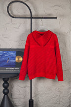 Red knit pullover hoodie with hood and allover logo pattern