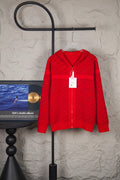 Red knit zip hoodie with hood and front zipper, hanging retail tag