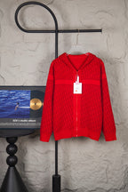 Red knit zip hoodie with hood and front zipper, hanging retail tag
