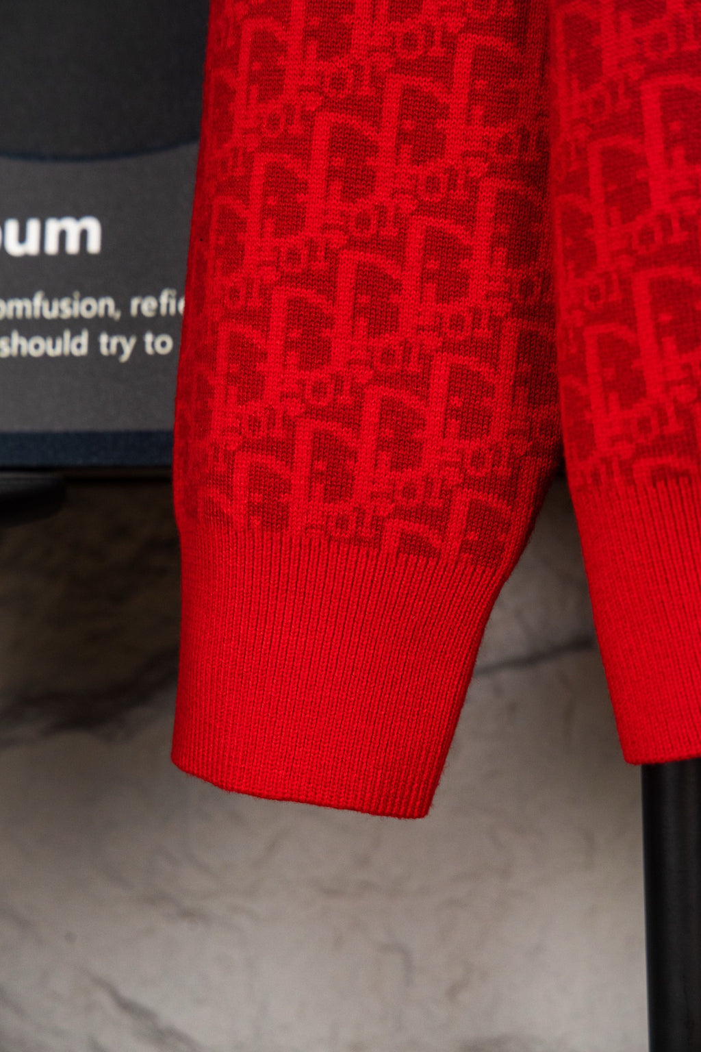 Red knit hoodie hem and sleeves with allover logo pattern