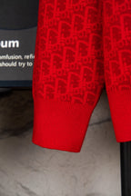 Red knit hoodie hem and sleeves with allover logo pattern