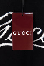 Black sweater with Gucci hang tag