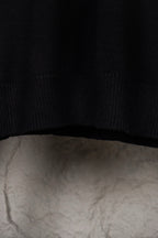 Black knit sweater hem with ribbed trim