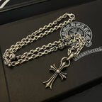 Silver cross pendant necklace with curb chain on black gift box