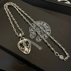 Heart pendant necklace with silver-tone chain on black accessory box