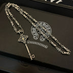 Set of two key pendant necklaces with chain, fleur charms, and key-shaped clasp