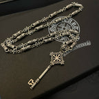 Pair of silver-tone key pendant necklaces with engraved bead chain and fleur charm